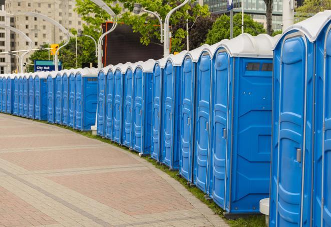 a row of portable restrooms at a fairground, offering visitors a clean and hassle-free experience in galion