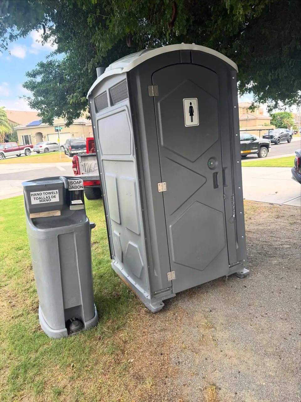 Handwashing station beside a porta potty